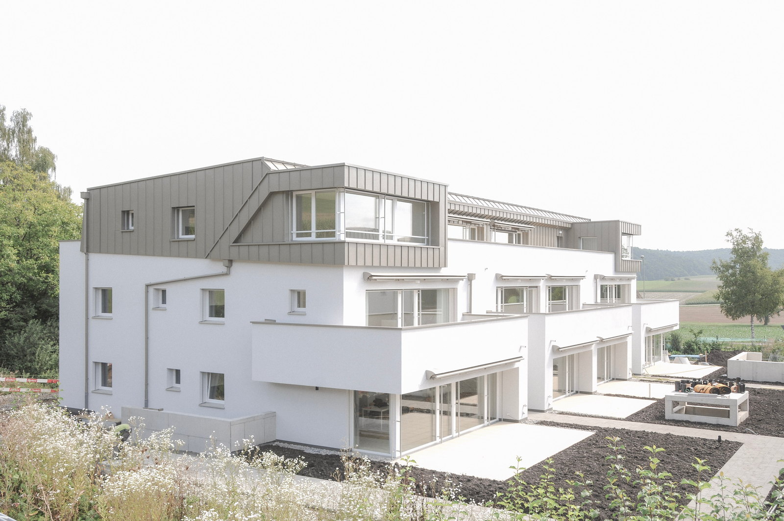 Mehrfamilienhaus Forêt in Stadel mit Attikageschoss und Gartenterrassen
