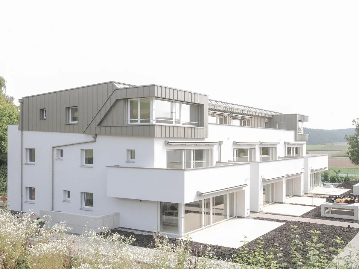Mehrfamilienhaus Forêt in Stadel mit Attikageschoss und Gartenterrassen